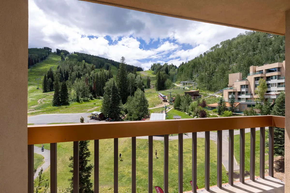 This image showcases the dramatic mountain scenery, lush greenery, visible ski slopes, and modern resort buildings. The setting is lively yet serene, perfect for families envisioning outdoor fun, memory-making, and scenic relaxation. The elements of the landscape directly connect to the ski activities and all-ages outdoor exploration referenced in the section.